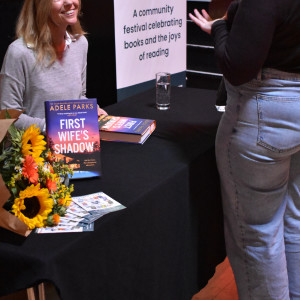 Adele Parks speaks to an event attendee