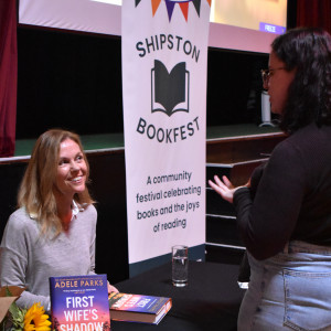 Adele Parks speaks to an event attendee